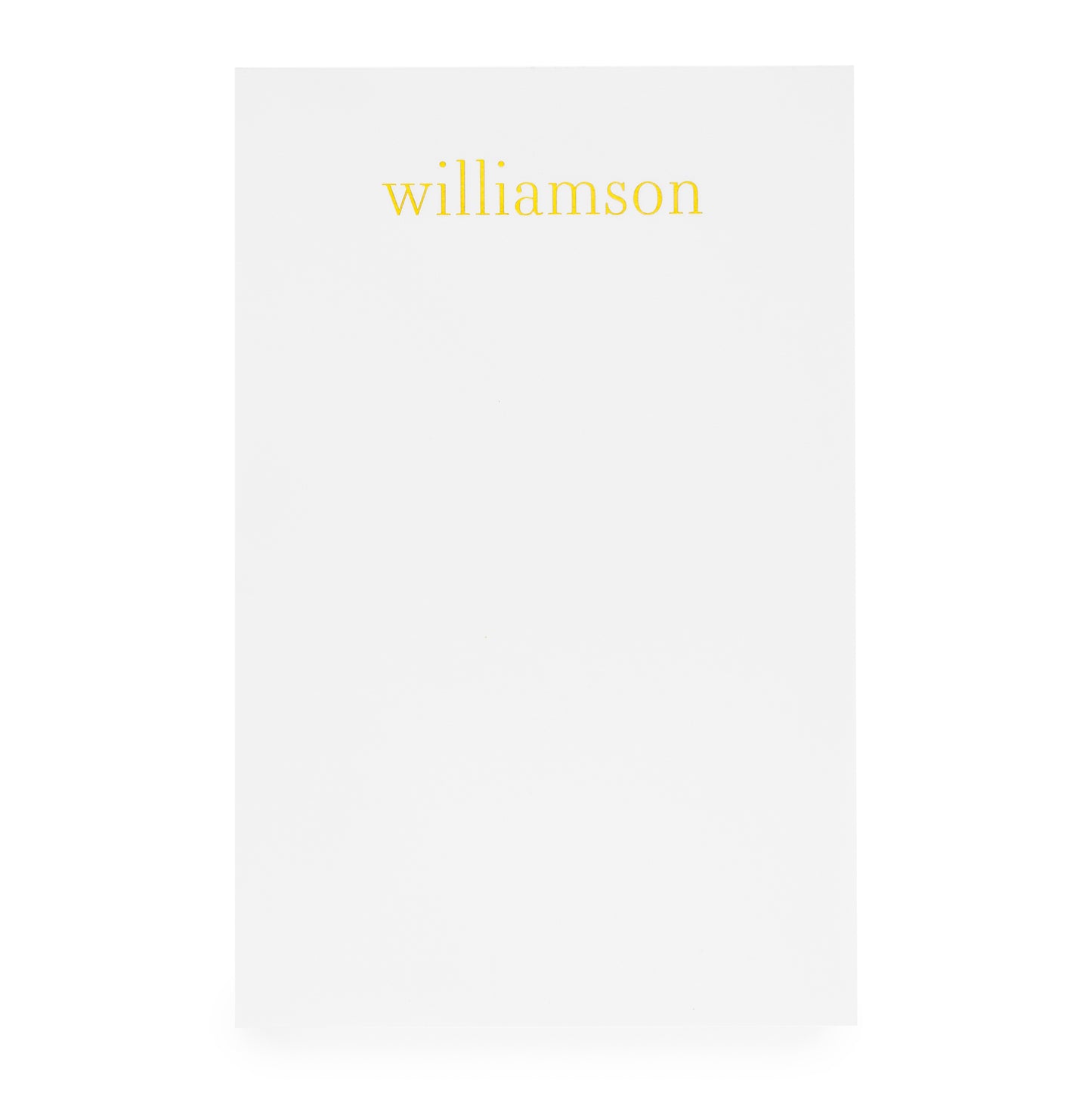 White notepad with gold foil 'williamson'