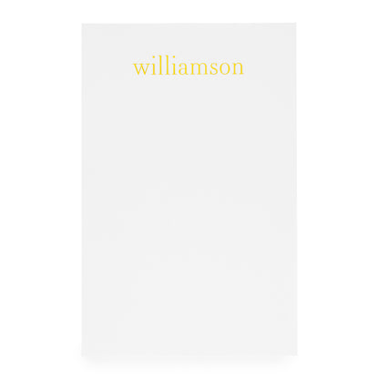 White notepad with gold foil 'williamson'