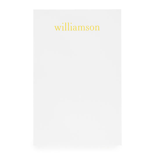 White notepad with gold foil 'williamson'