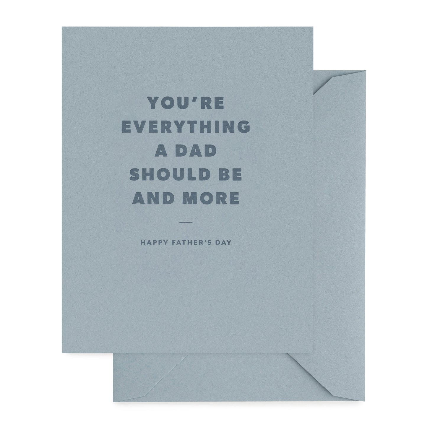 Father's Day card with 'you're everything a dad should be and more' with dark blue ink on a slate blue card with slate blue envelope