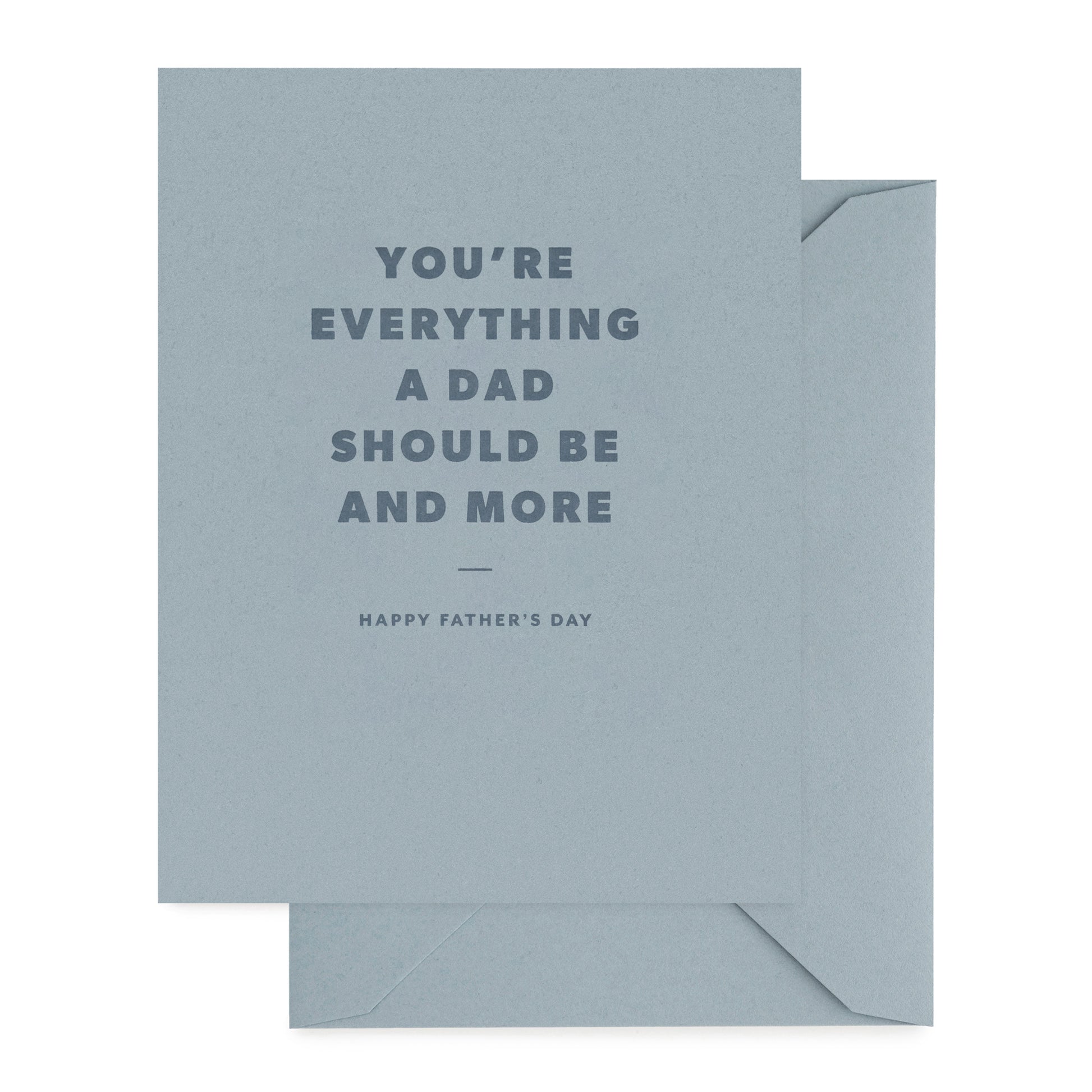 Father's Day card with 'you're everything a dad should be and more' with dark blue ink on a slate blue card with slate blue envelope