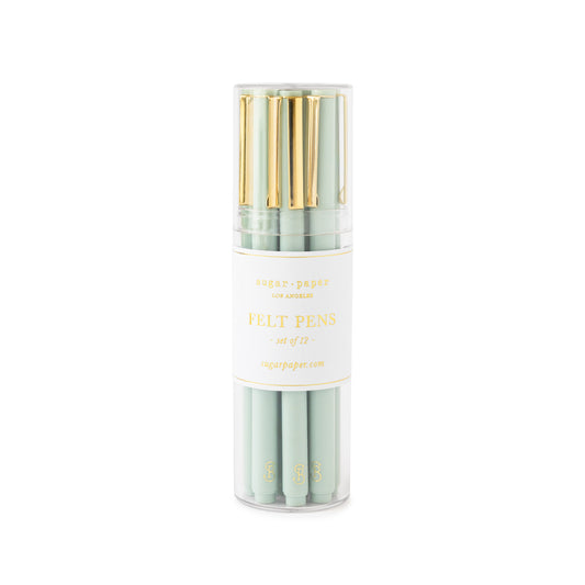 Office green felt pens with gold details in a clear acrylic case