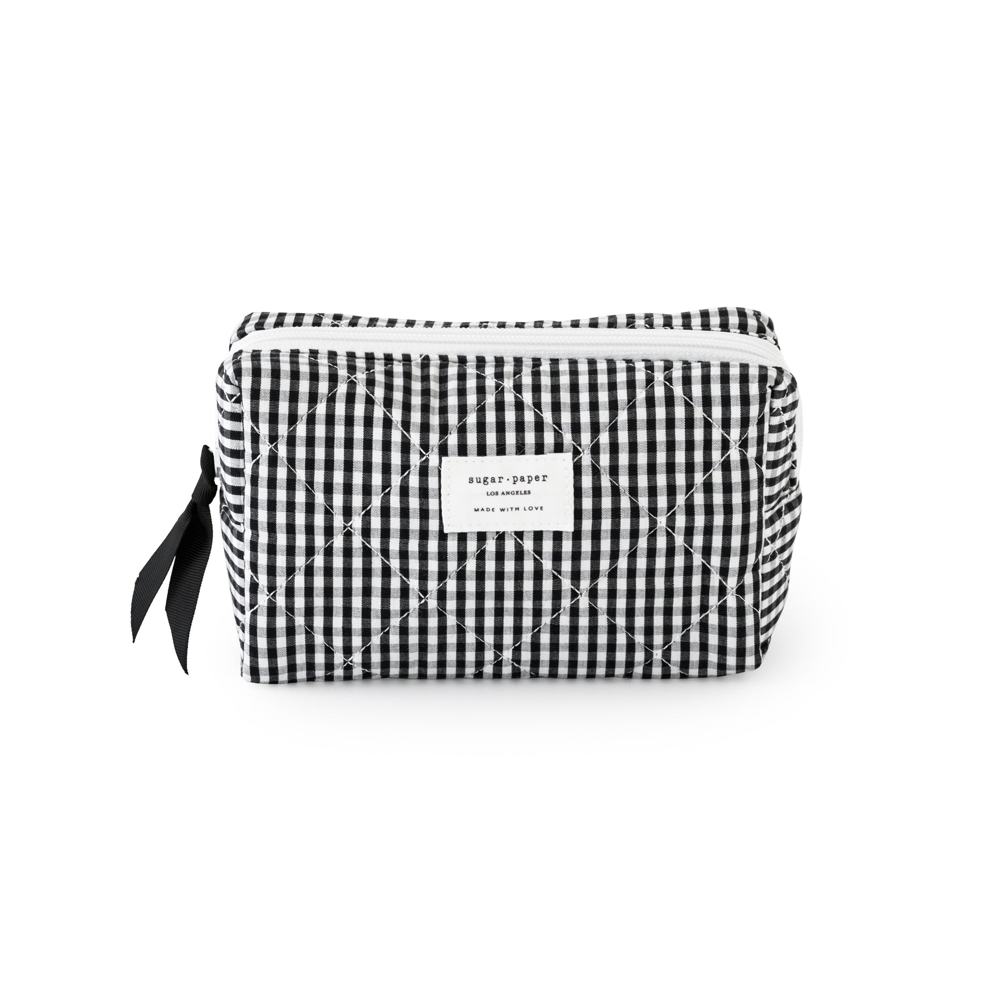 Black and white checkered pouch with a sugar paper logo, with a black ribbon and white zipper