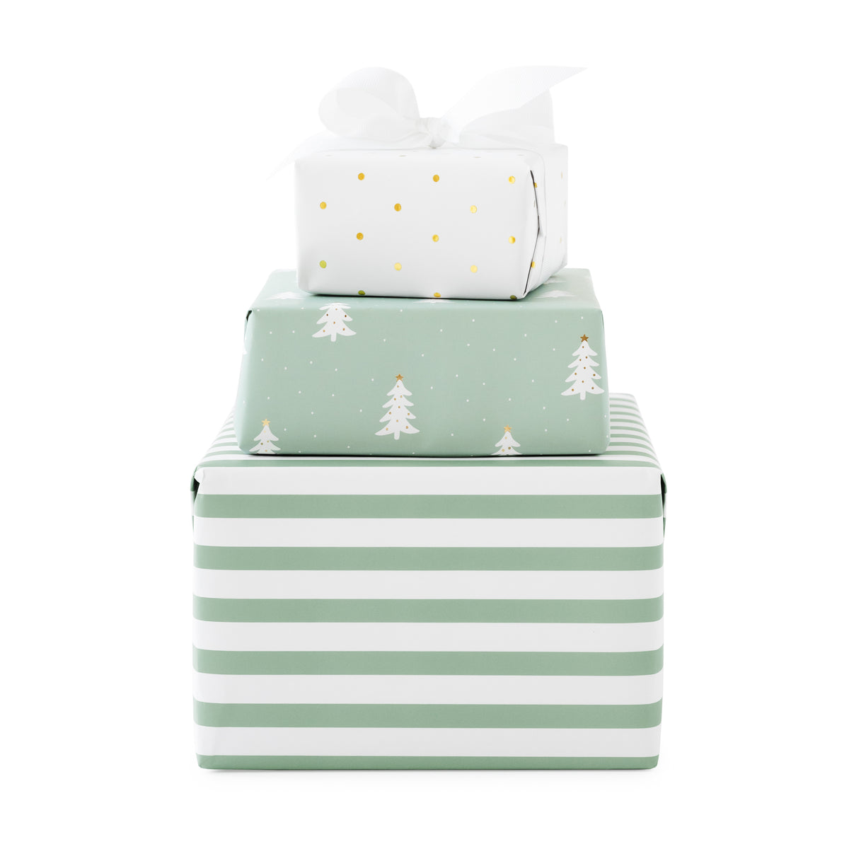 Three stacked gift boxes wrapped in coordinating holiday paper: a large white box with mint green horizontal stripes at the bottom, a medium mint green box with white Christmas trees, and a small white box with gold polka dots and a white bow on top