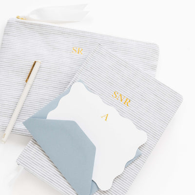 Gray ribbed socks with 'SNR' initials on a white background