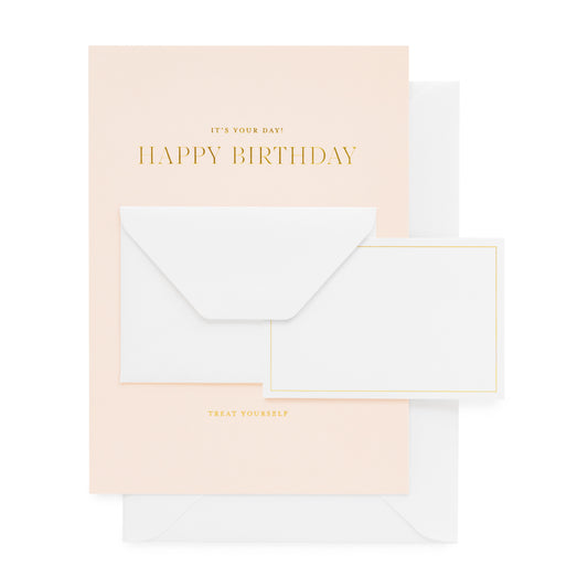 Pale pink card with gold foil printed 'it's your day happy birthday treat yourself' with a mini white enclosure card and envelope' and paired with a white envelope