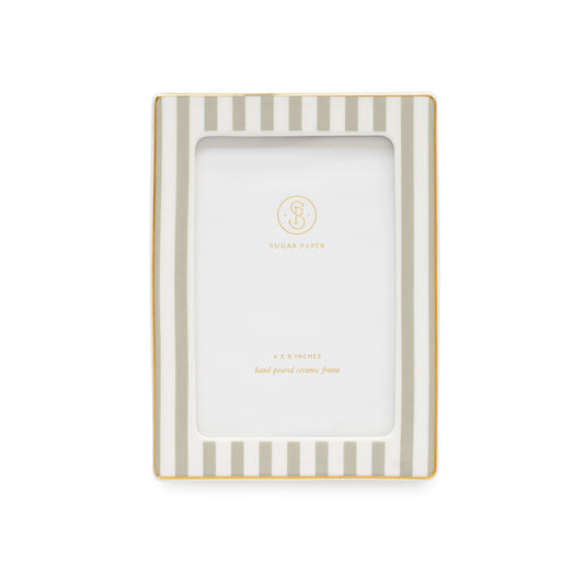 A rectangular picture frame with vertical gray and white stripes and a thin gold border, shown on a plain white background. The center insert is blank with a small gold 'Sugar Paper' logo and '4x6 inches hand-poured ceramic frame'