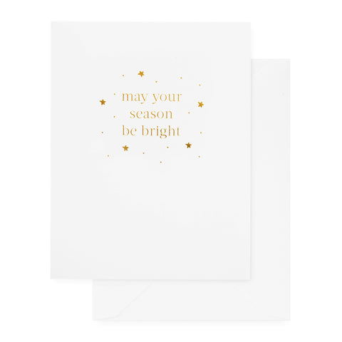 white holiday card with gold text and white envelope