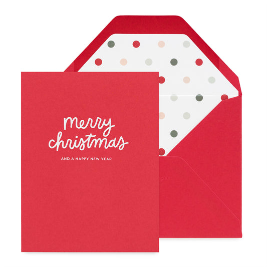 Red Christmas card with 'Merry Christmas and a Happy New Year' text, featuring a polka dot envelope liner in a red envelope