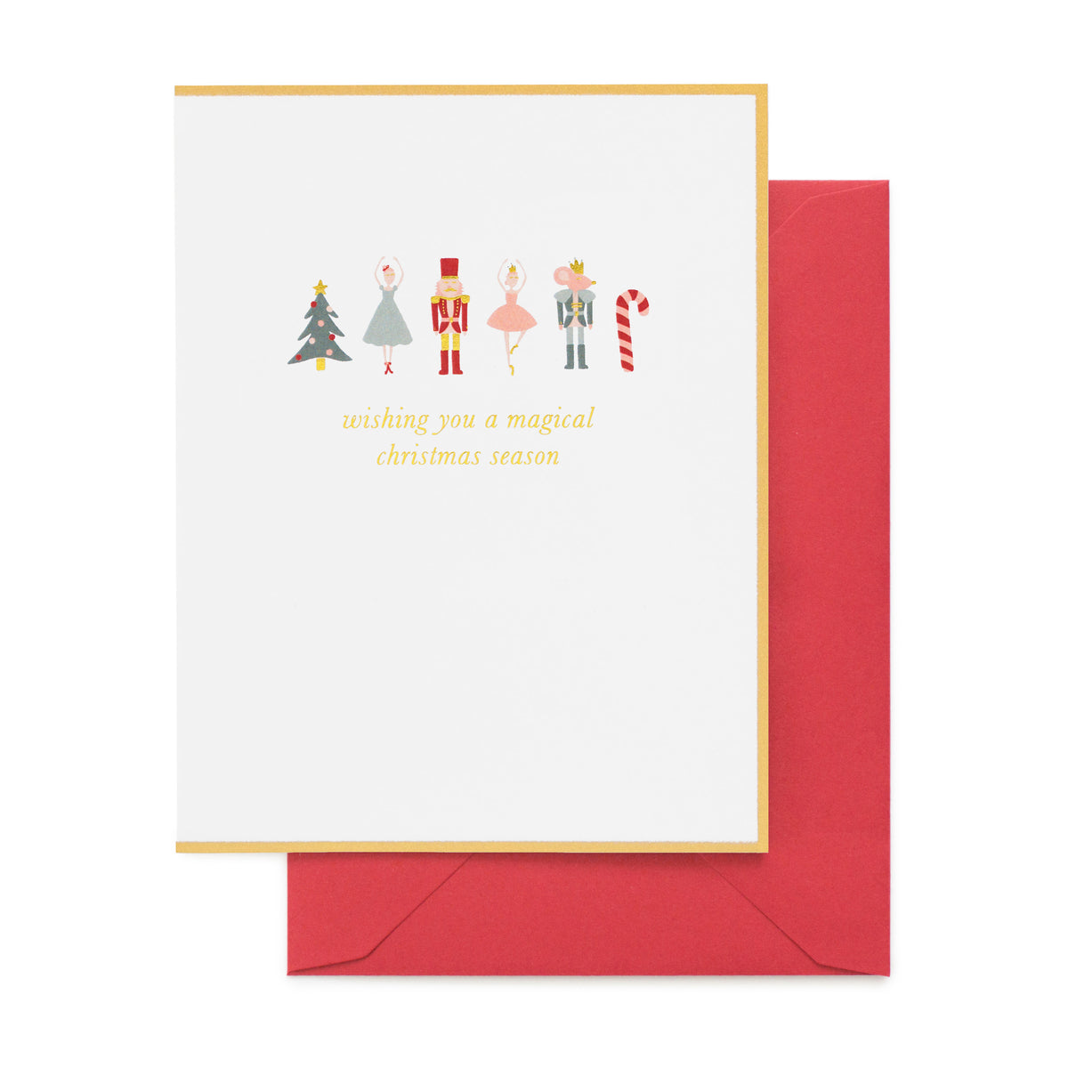 A white Christmas greeting card with a gold border, featuring simple illustrations of holiday Nutcracker figures and the phrase 'wishing you a magical Christmas season' in gold foil, shown with a red envelope