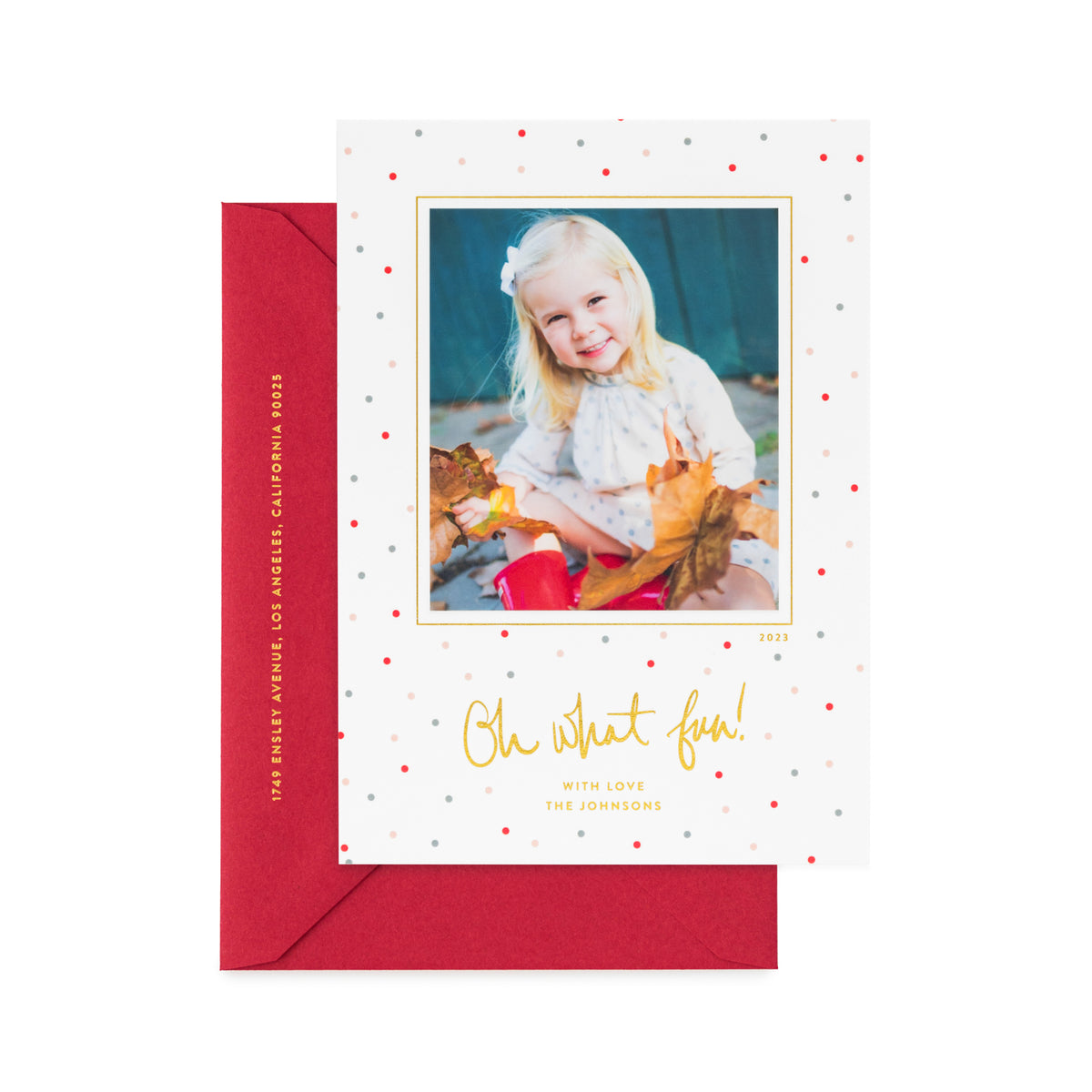 photo holiday card with multicolored dots and gold foil on white paper, red envelope