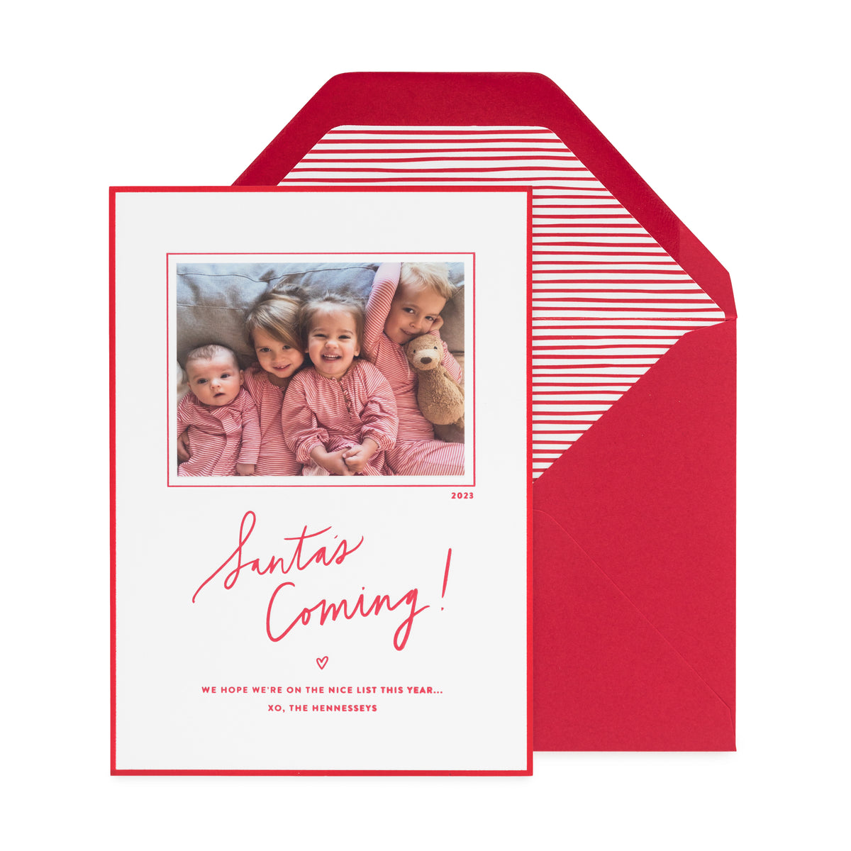 photo holiday card with red ink and border on white paper, red stripe liner, red envelope