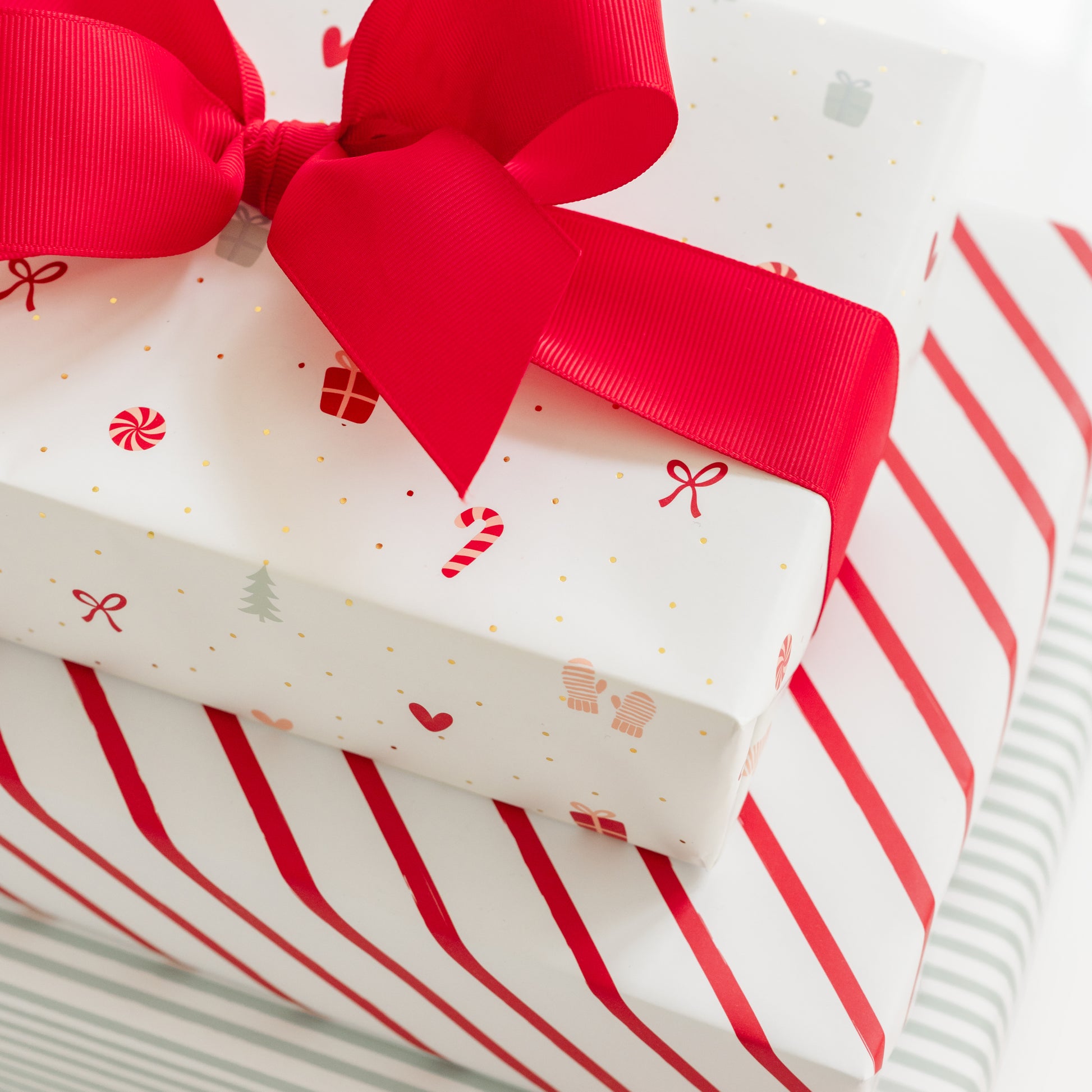 Christmas wrapped gifts with red ribbon