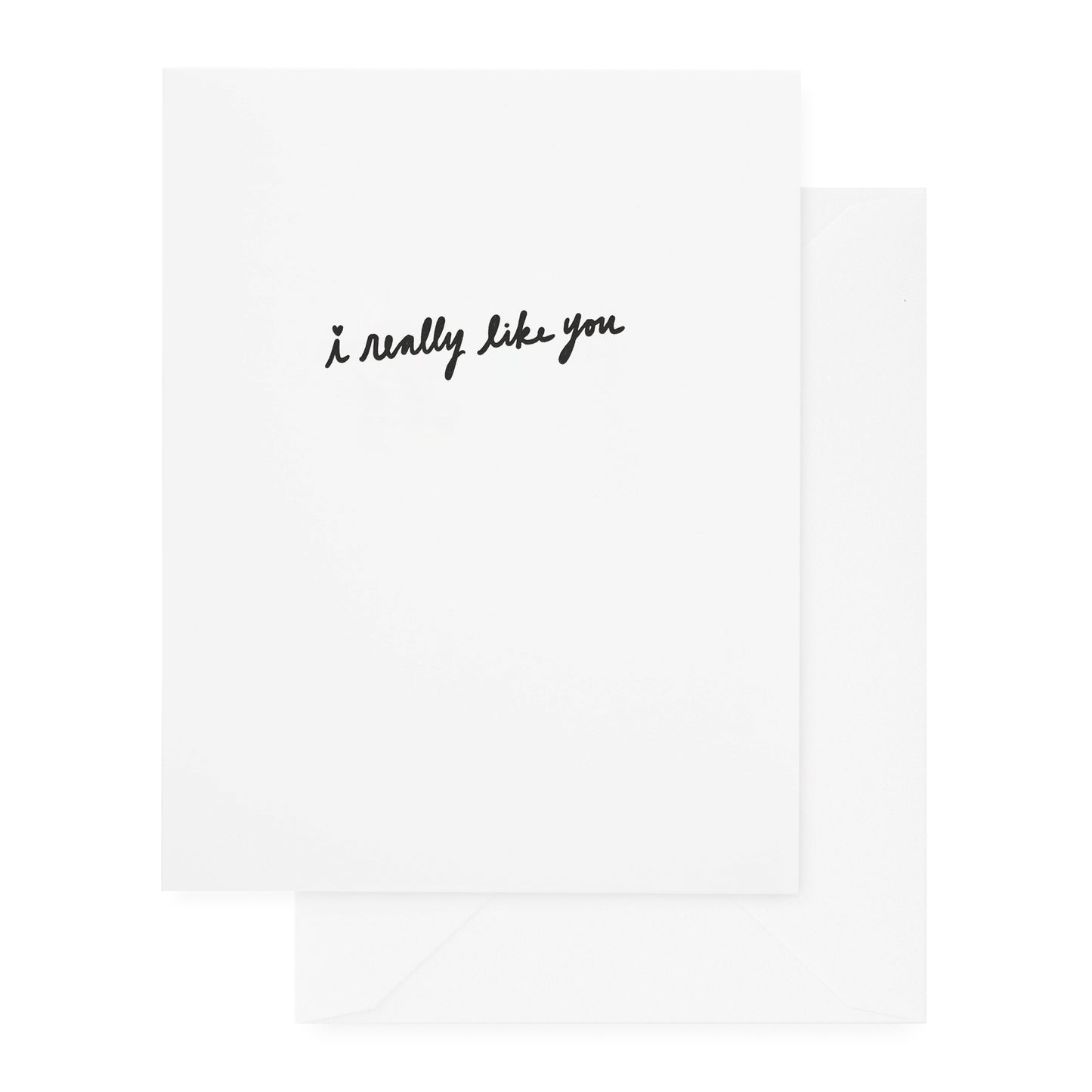 white folded card with black i really like you text