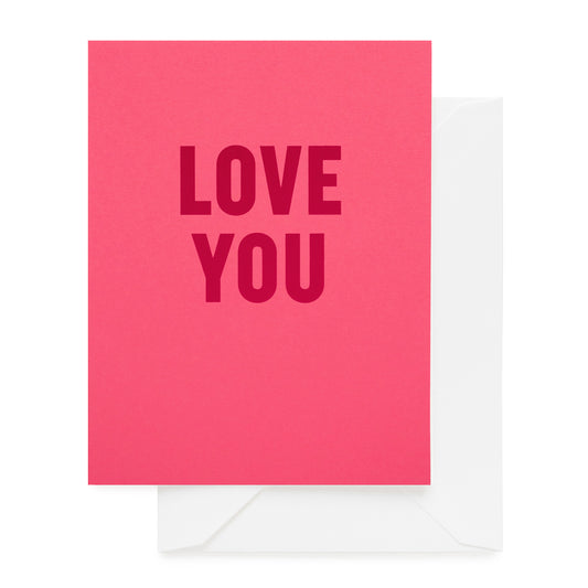 hot pink folded card with red love you text