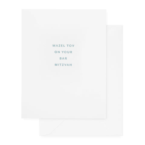white bar mitzvah card with slate blue text and white envelope
