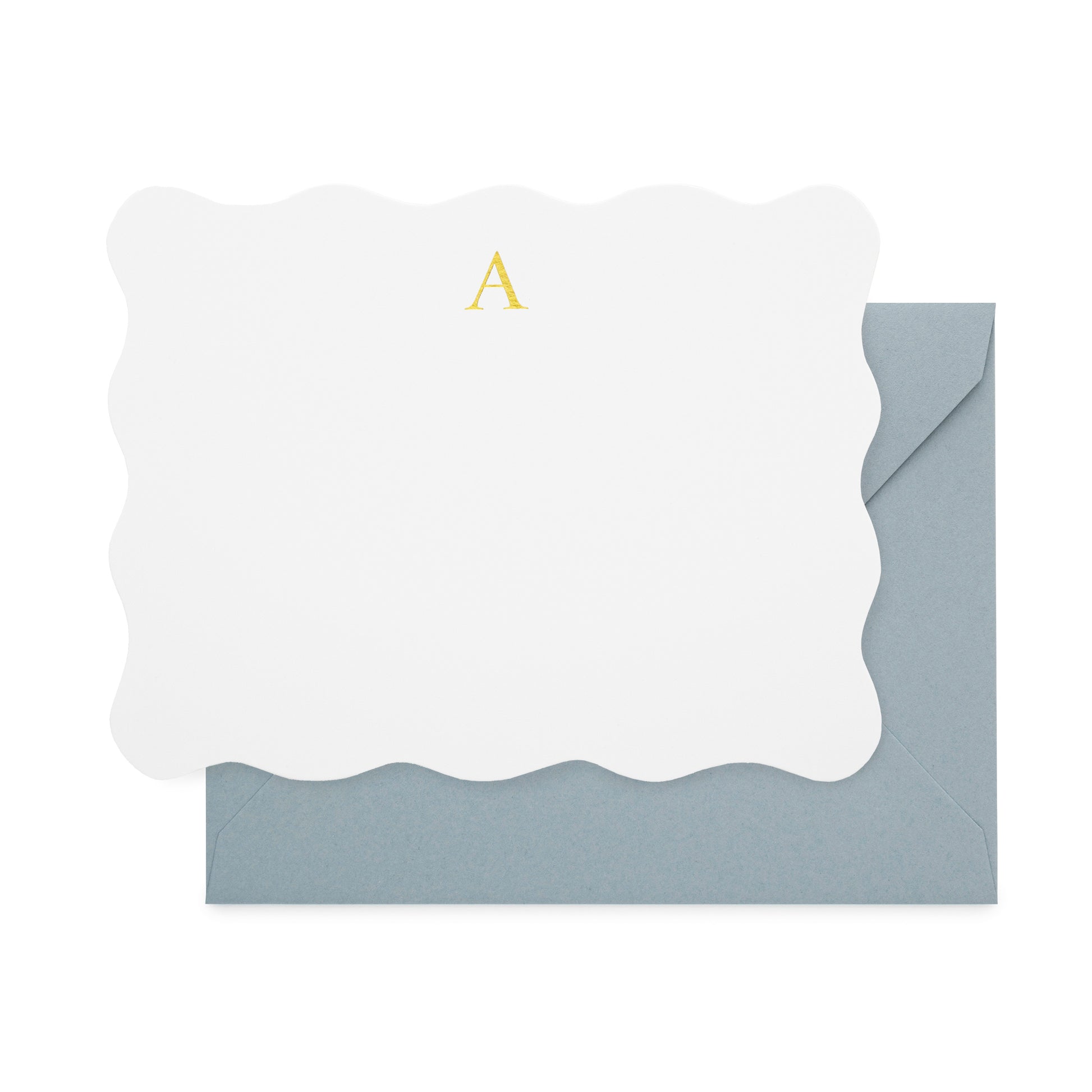 White bordered scallop with gold foil initial 'a' paired with a slate blue envelope