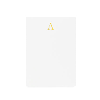 Mini white notepad with a gold foil 'A' on it