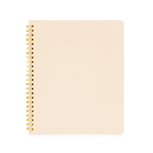 Pale pink spiral notebook with gold coil spiral