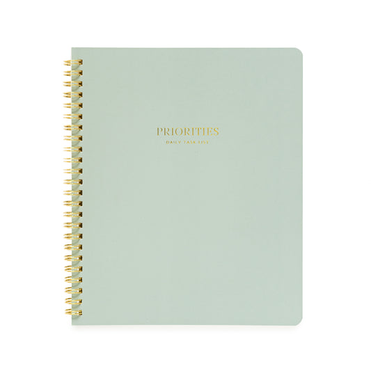 Green spiral notebook with priorities daily task list in gold