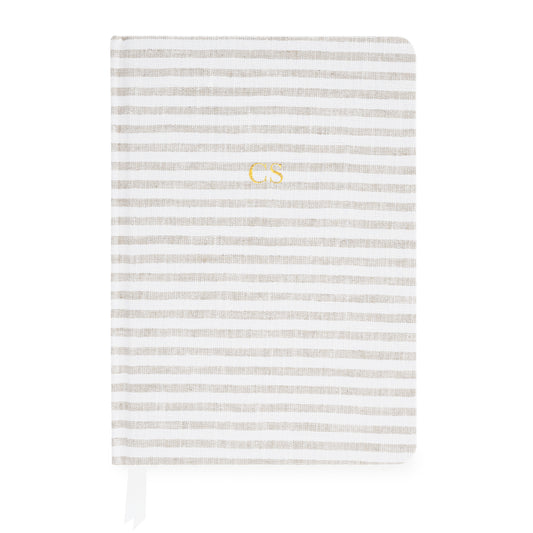 Beige and white striped journal with gold foil initials