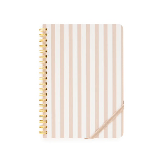 Notebook with blush and white striped cover and gold spiral binding