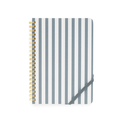 Notebook with blue and white striped cover and gold spiral binding on a white background