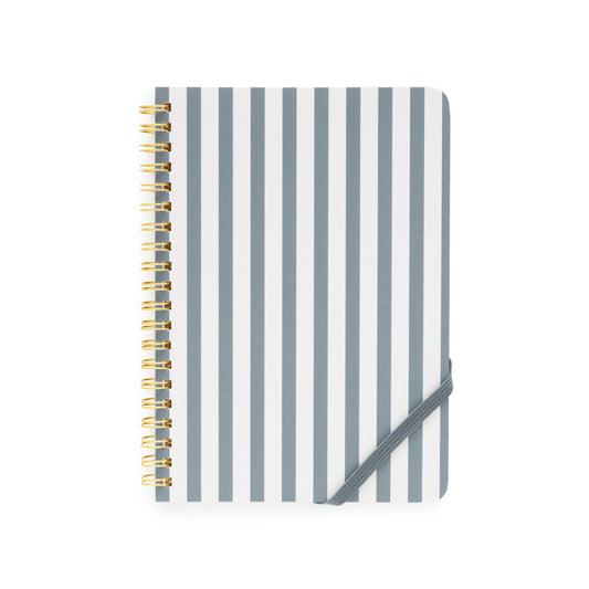 Notebook with blue and white striped cover and gold spiral binding on a white background