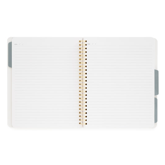 Interior of tabbed spiral notebook with gold spiral binding and 3 blue tab dividers