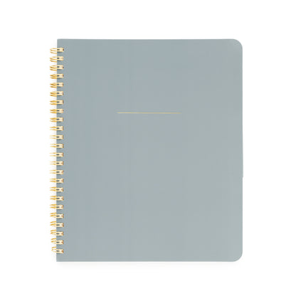 Dusty blue notebook with gold spiral binding