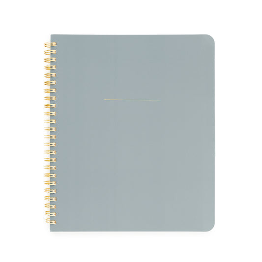 Dusty blue notebook with gold spiral binding