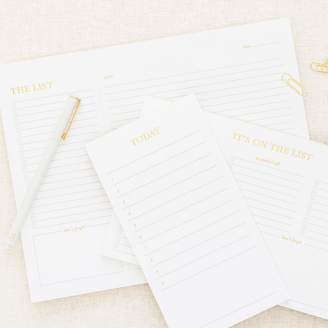 white and gold list pads
