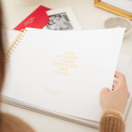 Interior of holiday card book with foil details