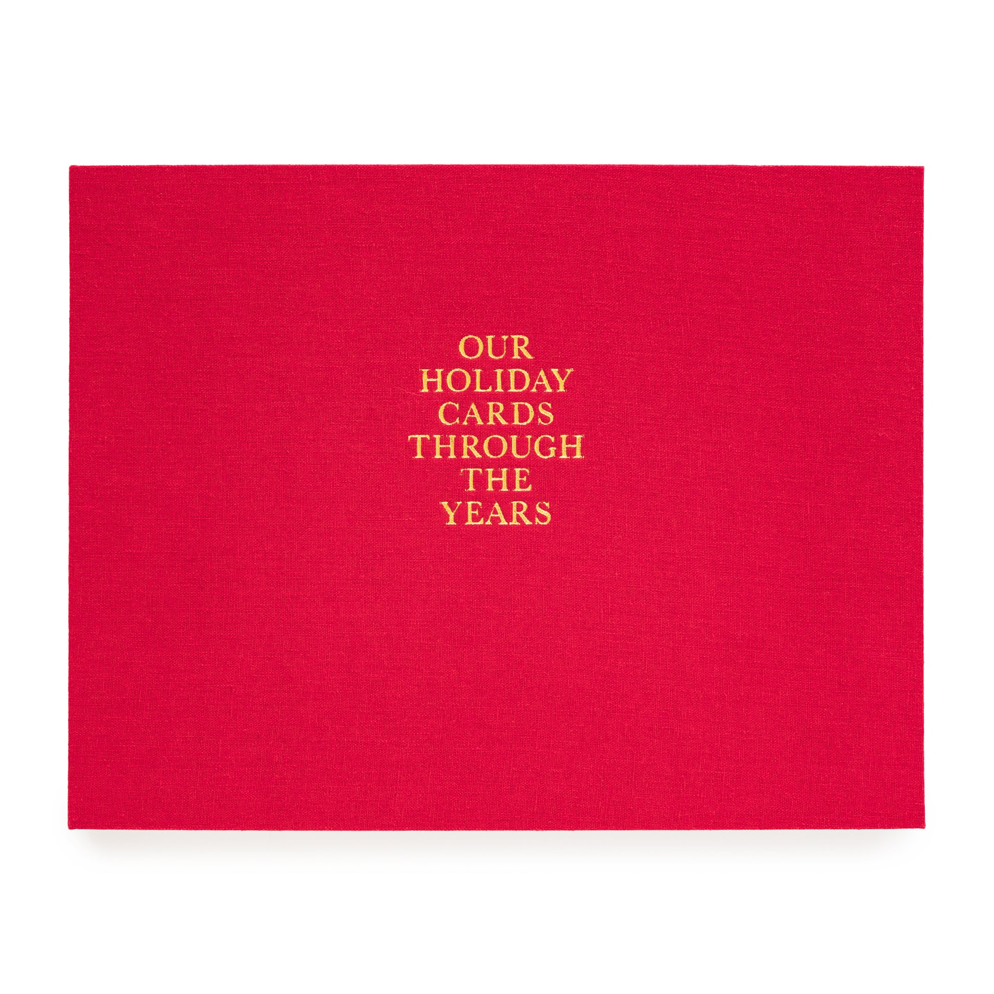 Red holiday card book printed with our holiday cards through the years