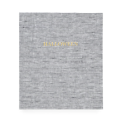 Black and white striped fabric bound book with 'halloween' in gold foil stamped on the cover