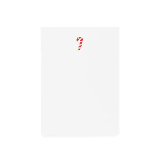 white notepad with red and pink candy cane printed on it