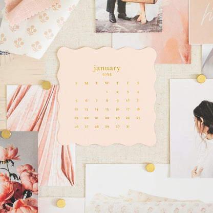 pink desk calendar on pinboard