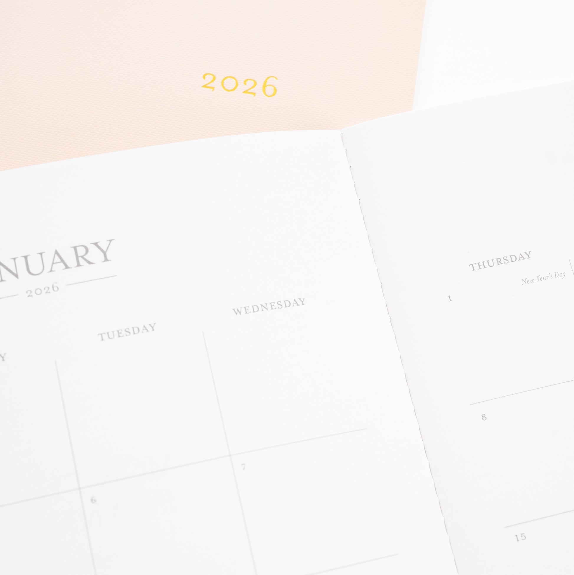 pink monthly 2026 planner with closeup of january 2026 monthly calendar