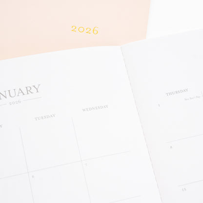 pink monthly 2026 planner with closeup of january 2026 monthly calendar