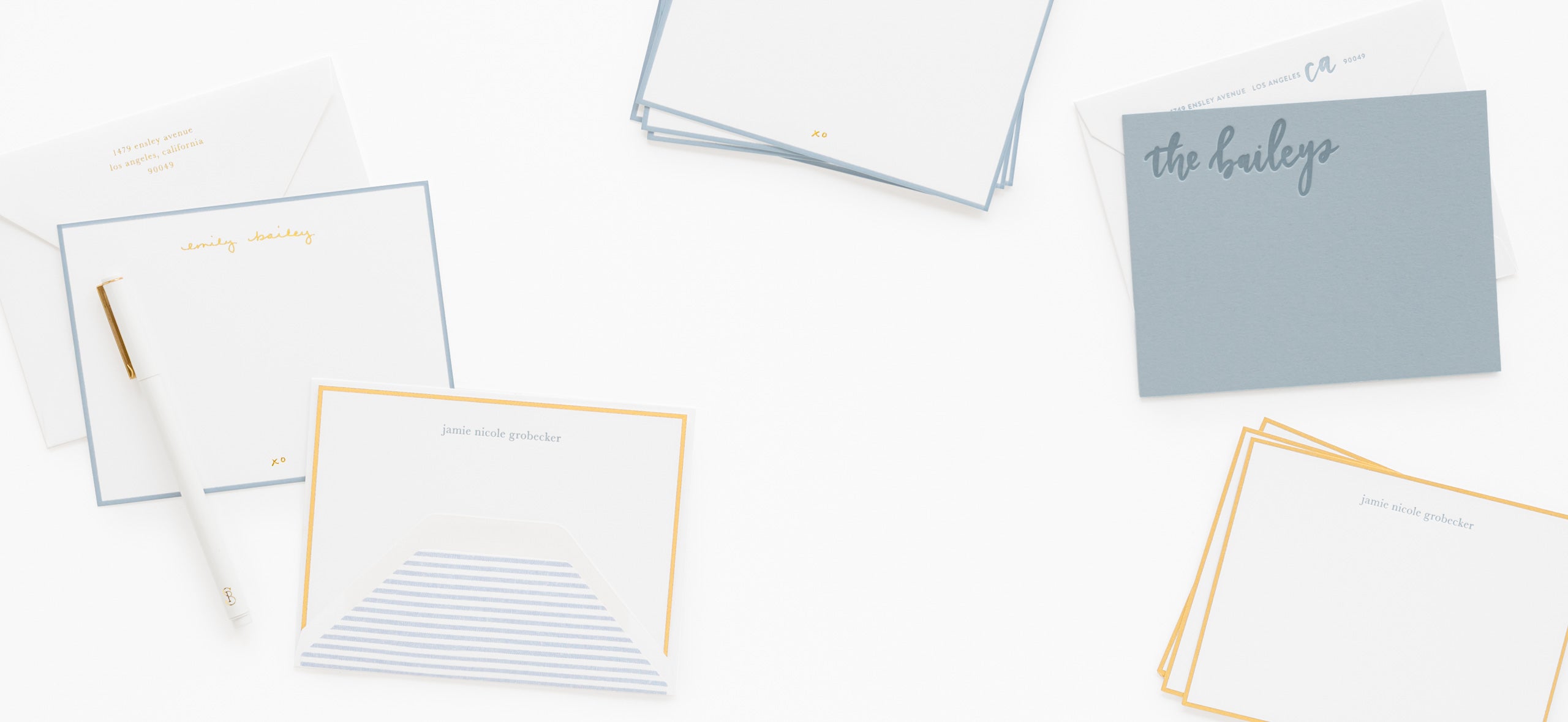 Set of stationery items including cards and envelopes on a white background