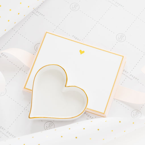 gold heart notecard with gold border with a ceramic heart tray