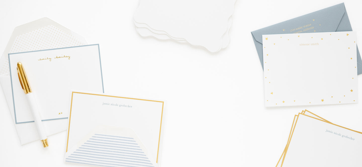 personalized stationery in white, blue, and gold