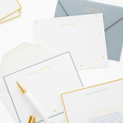 personalized stationery in white, blue, and gold
