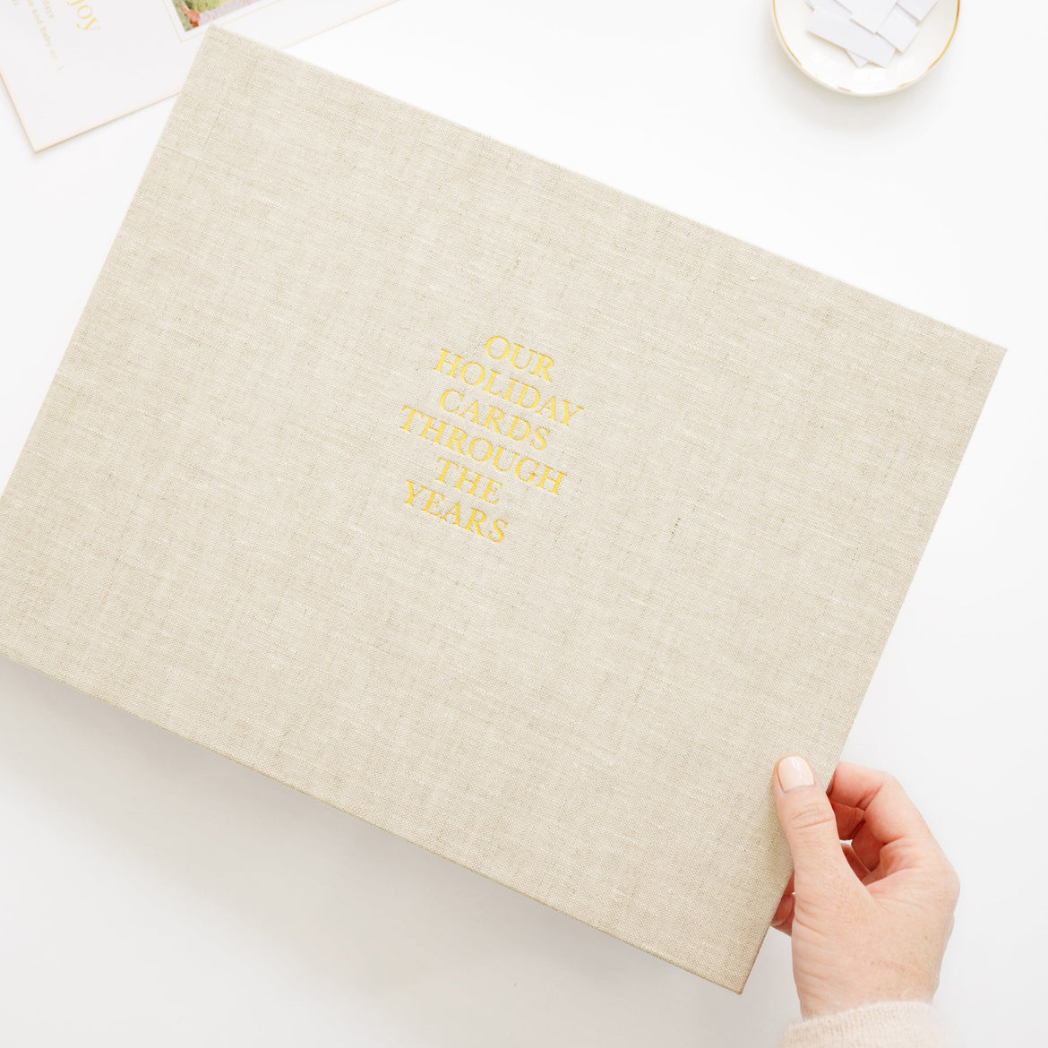 Flax Holiday Card book cover with gold foil our holiday cards through the years