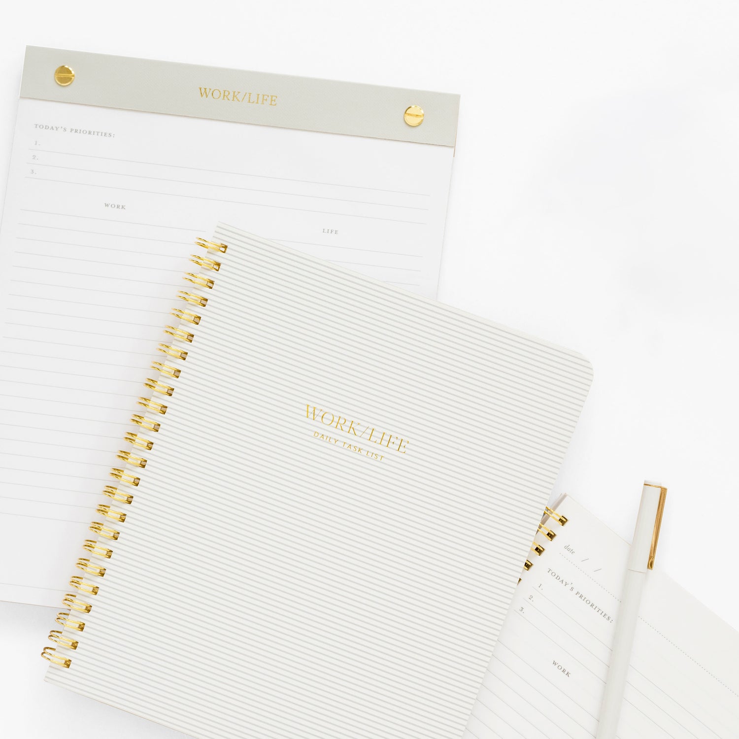 White planner with gold accents on a white background