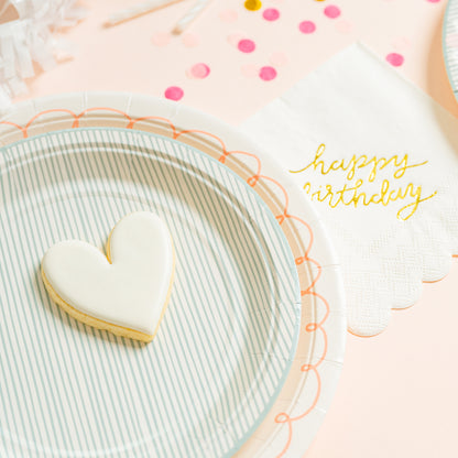 Pink swirl plate with blue stripe plate and heart cookie
