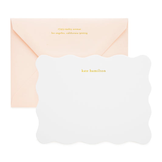 White scalloped custom stationery notecard foil printed with kate hamilton and paired with a pale pink envelope