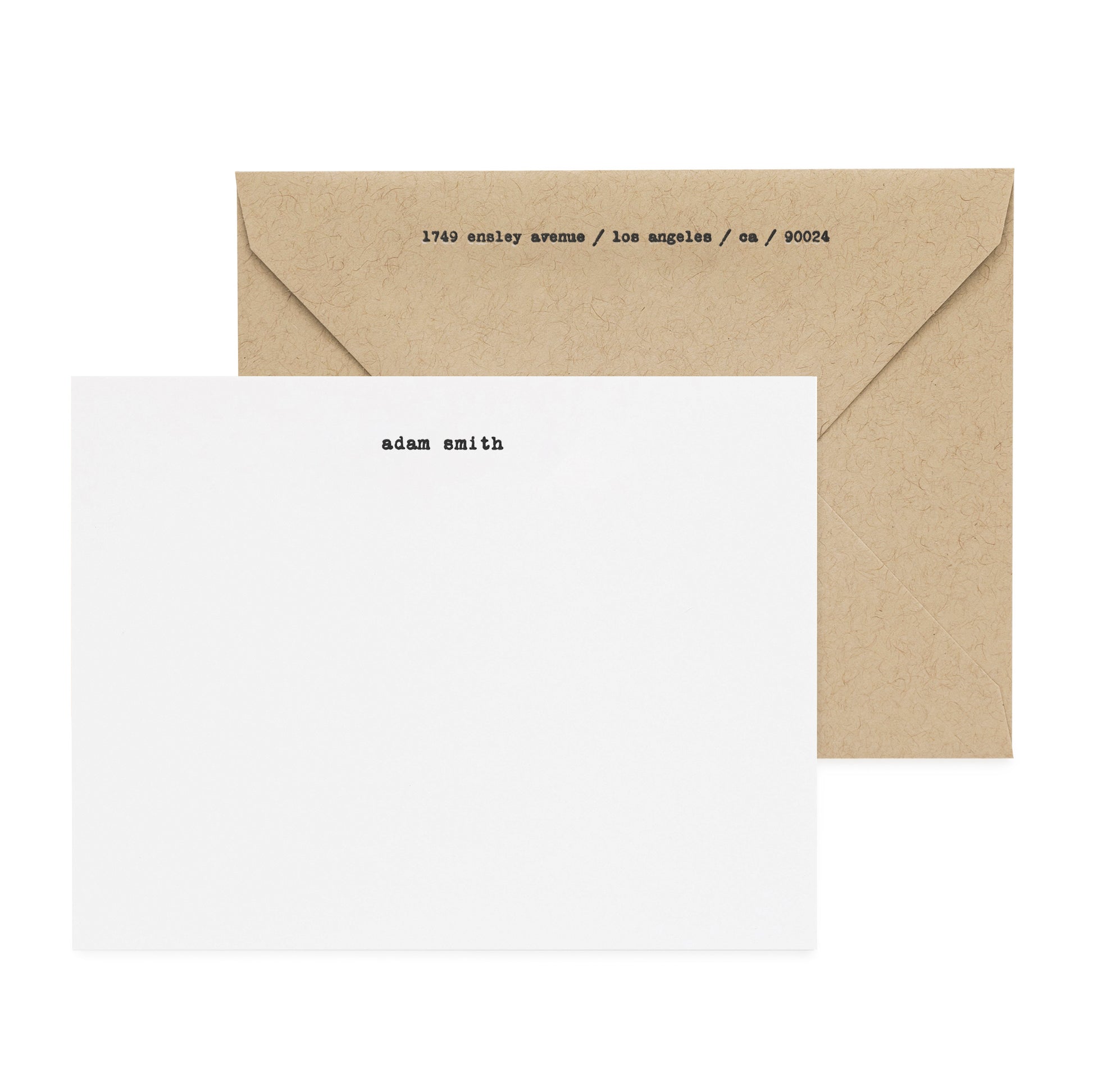 Black letterpress printed custom stationery paired with a kraft envelope