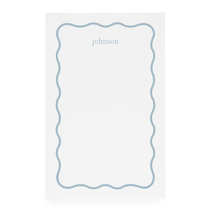White notepad with blue scallop border and blue 'johnson' text