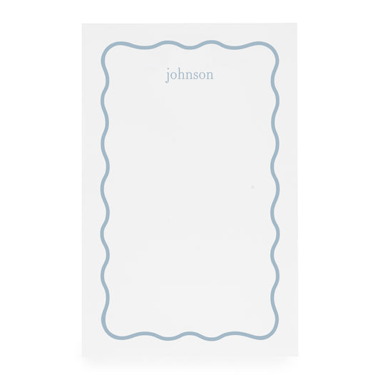 White notepad with blue scallop border and blue 'johnson' text